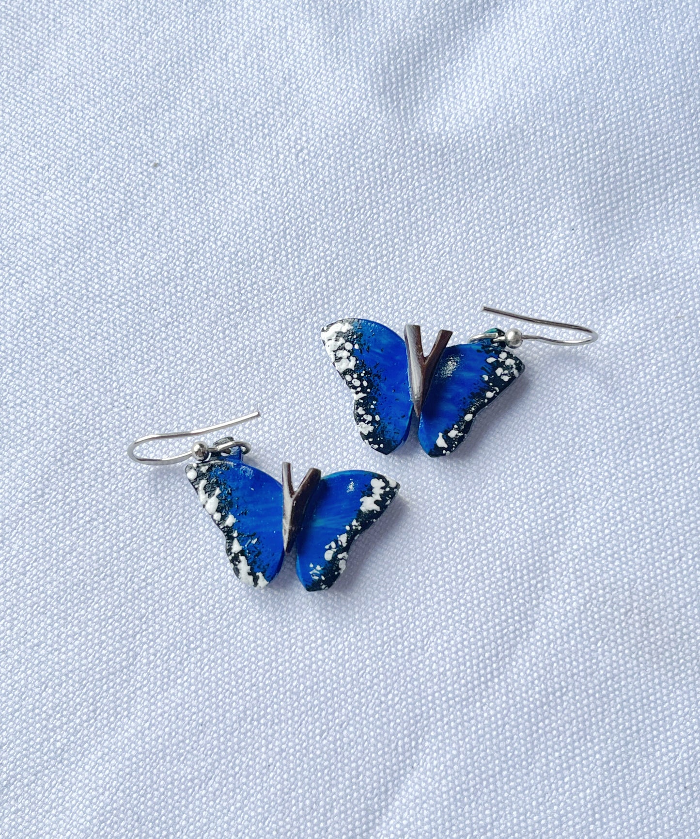 Aretes de coco mariposa morpho