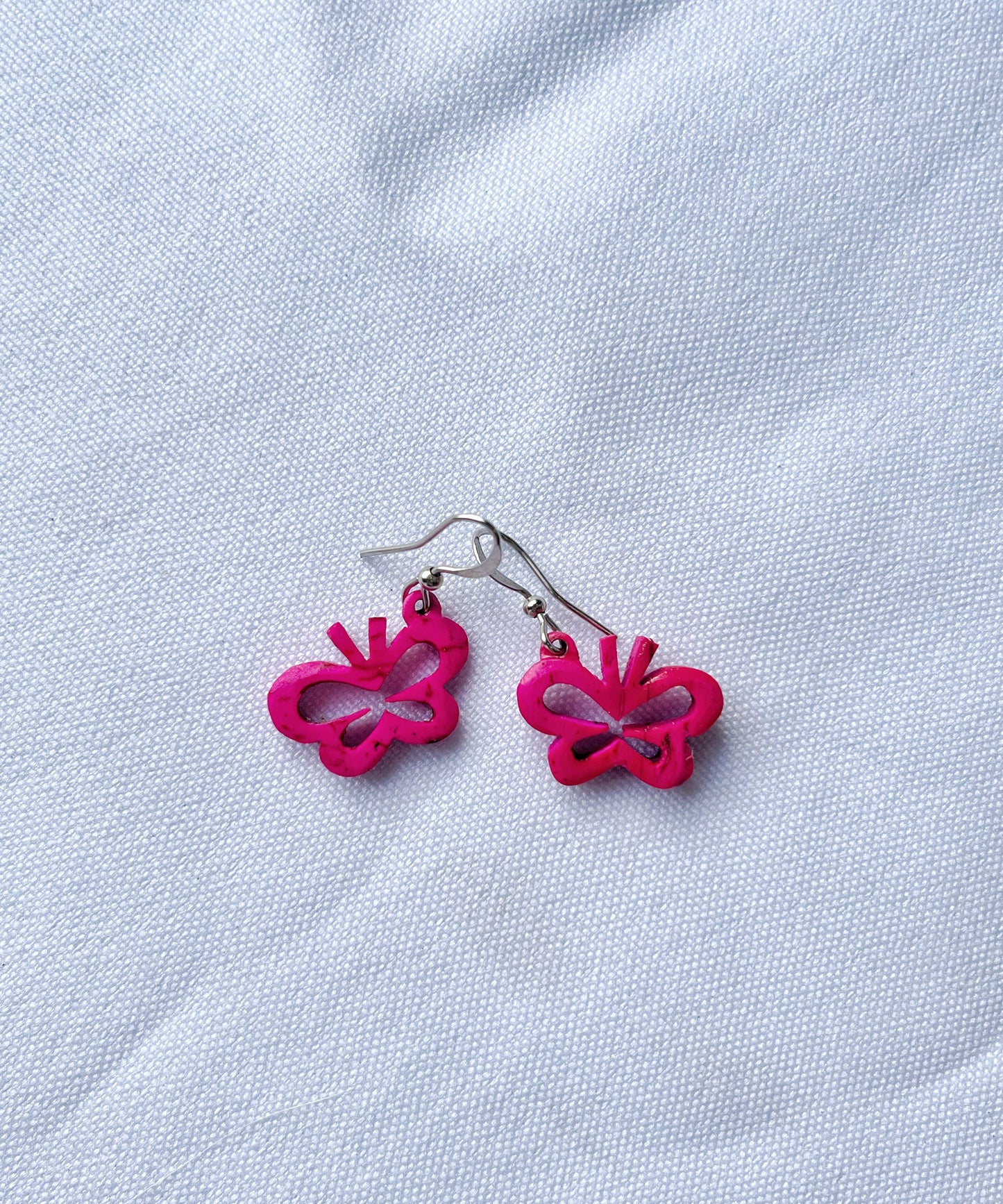 Aretes de coco mariposa